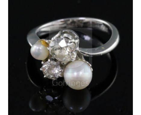 A white gold? and graduated two stone diamond and two stone cultured pearl set dress ring by C. Azzopardi &amp; Sons, size O.