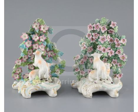 Two similar Derby groups of sheep in a flower arbor, c.1765, scrollwork bases, one with patch marks, H. 15.5 and 16cmCONDITIO