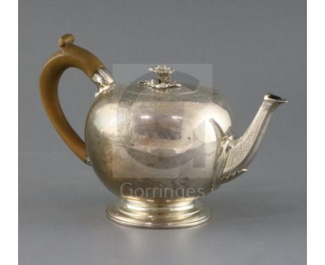 A Victorian silver bullet shaped teapot, by Walter Morrisse, with engraved decoration and crest and rose finial, London, 1854