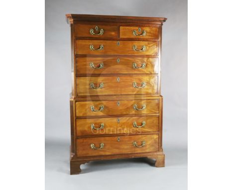 A George III mahogany chest on chest, with dentil cornice, two short and three graduated long drawers over three further long