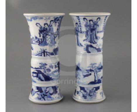 A pair of Chinese blue and white beaker vases, Gu, Kangxi period, each painted to the upper register with the Four Beauties a