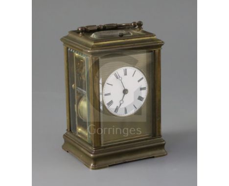 A late 19th century French lacquered brass hour repeating carriage clock, in gorge case, with circular enamelled Roman dial a