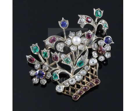 An early 20th century gold and multi gem set guiardinetto (flowers in a basket) brooch, set with rubies, emeralds, sapphires,