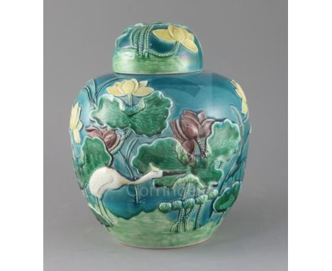 A large Chinese polychrome glazed jar and cover, late 19th century, signed Wang Bingrong, moulded in relief with an egret ami