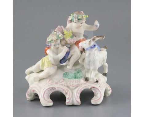 A Vauxhall porcelain group of two Bacchanalian cherubs and a goat, c.1760-5, on a scrollwork base, unmarked, H. 14.5cmCONDITI