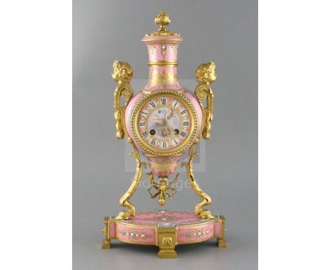 A late 19th century French ormolu mounted Sevres style porcelain mantel clock, with jewelled decoration, of urn form supporte