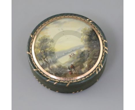 An early 19th century French bois durci snuff box, with gold inlaid decoration, the lid inset with a reverse painted glass pa