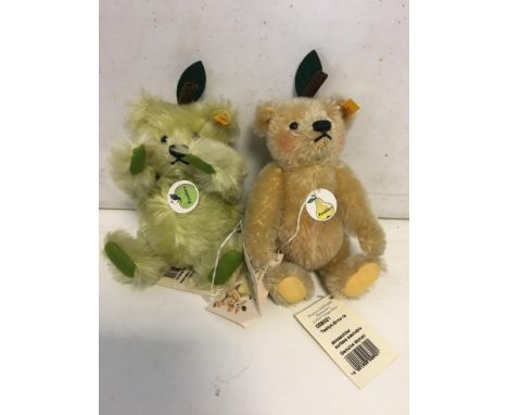 Two Steiff fruit bears with labels and buttons