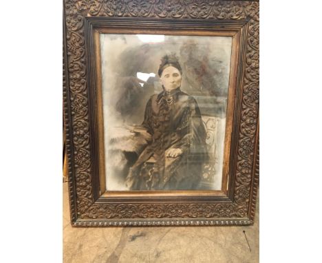 C1900 painted photo portrait of a woman in ornate period frame.
