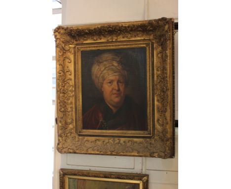 Follower of Joseph Wright of Derby portrait of a gentleman wearing a bejewelled turban and red cloak, oil on canvas, 48cm by 