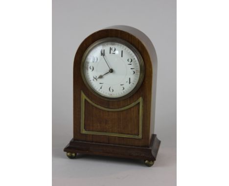 An Edwardian mahogany cased mantel clock with eight day movement and circular white enamel dial, with Arabic numerals, 21.5cm