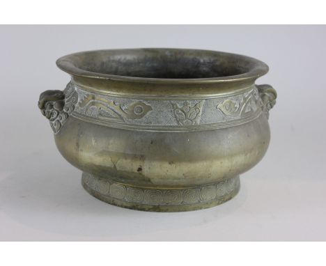A Chinese bronze censor cast with lion head handles and rim with band of motifs, 32cm, (NC)
