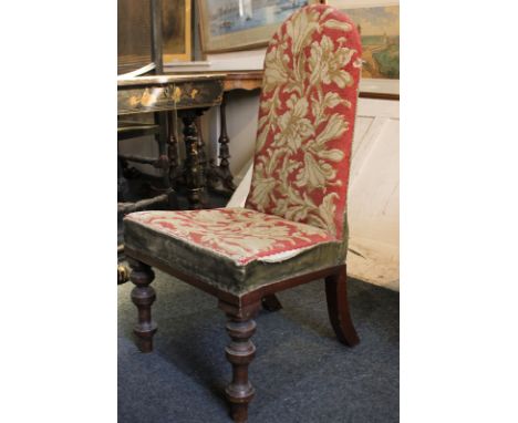A Victorian tapestry upholstered low chair with arched back, on turned mahogany legs (NC)
