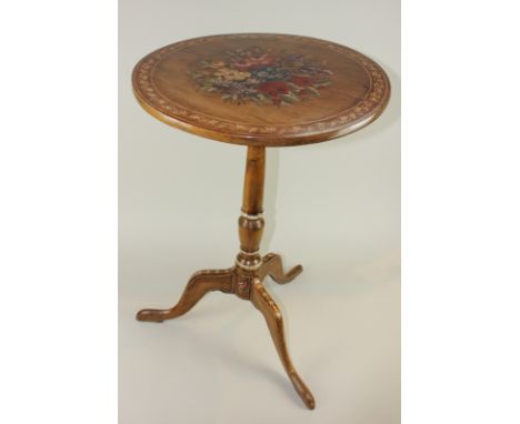 A 19th century mahogany circular table with later floral painted tilting circular top, on turned column and tripod base, 46cm