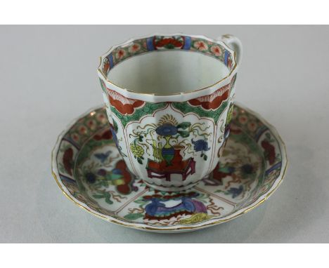 A rare early Worcester porcelain teacup and saucer (square seal mark) decorated with 'dragons' and temple dogs in bright enam