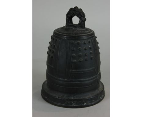 A Chinese bronze hanging bell-shaped gong with ring surmount and dimpled panels, 22cm high, (NC)