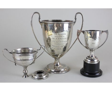 A George V silver trophy cup, Sheffield 1913, together with two other silver trophy cups (one a/f), all inscribed, 22oz