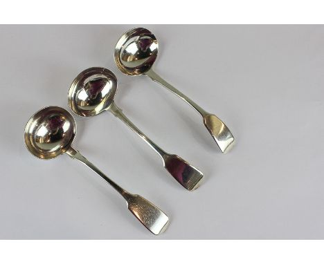 A pair of William IV fiddle pattern silver sauce ladles, London 1830, together with another Victorian fiddle pattern sauce la