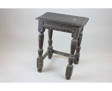 A 17th century oak joint stool (stretcher rails missing) (NC)