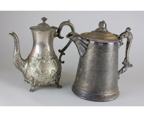 A heavy Victorian silver plated hot water jug with scroll handle and finial, modelled as a bunch of grapes on vine, stamped M
