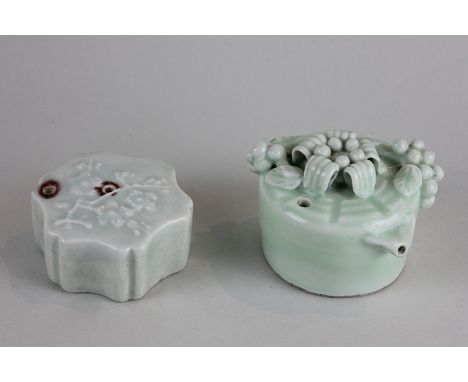 Two Chinese celadon porcelain incense stick burners, 9cm