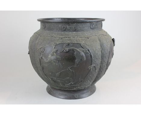 A Japanese bronze jardiniere cast with panels of exotic birds, 32cm (NC)
