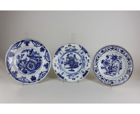 Three various Delftware pottery dishes decorated with flowers, largest 25cm, (NC)