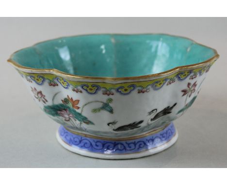 A 19th century Chinese porcelain lotus shaped bowl, Tongzhi seal mark to base, the interior with turquoise glaze, the outer b