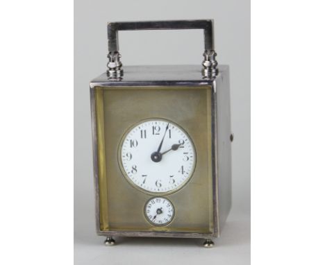 A late 19th, early 20th century French small silver collared metal cased carriage clock, stamped Covaillet Freres with circul