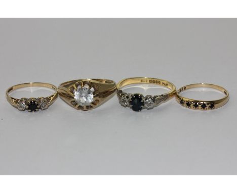 Three sapphire and diamond rings and a white sapphire ring in 9ct gold