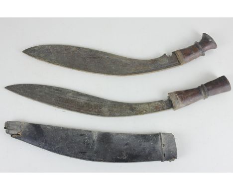 Two 19th century Gurkha kukri knives with wooden handles, largest with 34cm blade and scabbard (a/f), (NC)