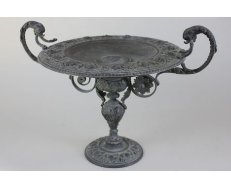 A bronze two-handled tazza baluster stem with scroll supports, decorated with cornucopia of flowers, 36cm, (NC)