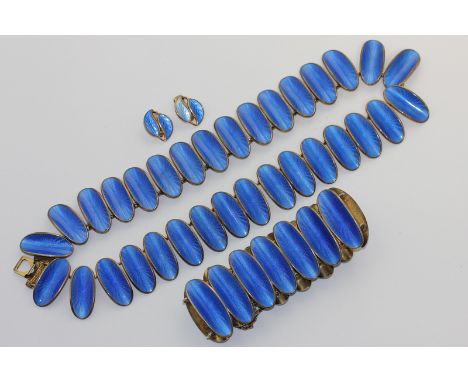 David Andersen a Norwegian silver gilt and blue enamel necklace strung with curled oval links guilloche enamelled in blue, a 