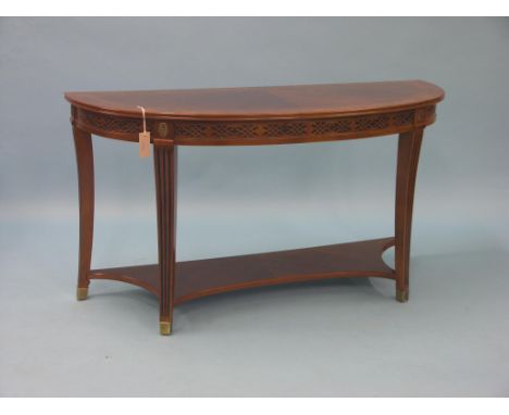 A period-style fruitwood console table, half-round top with burr walnut cross-banding, on reeded legs with shaped undertier a