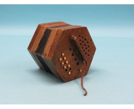 A grained rosewood concertina, hexagonal-shape playing ten notes to each side, poor condition