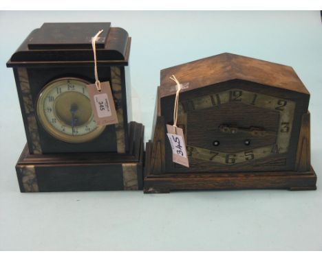 A Victorian black slate mantel clock, with French timepiece movement, and a 1930's oak mantel clock, one pendulum, two keys