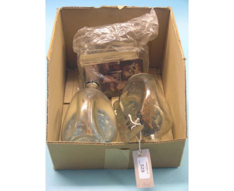 A quantity of early 20th century postcards, together with two ships in bottles and a brass uniform button-stop 