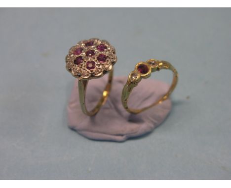 A gold, diamond and ruby cluster ring, rosette design, size O, and a yellow metal diamond and ruby ring