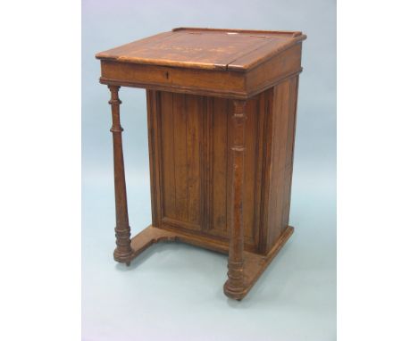 A Victorian stained pine clerk's desk, sloping top with enclosed recess, reverse side with single shelf enclosed by panelled 