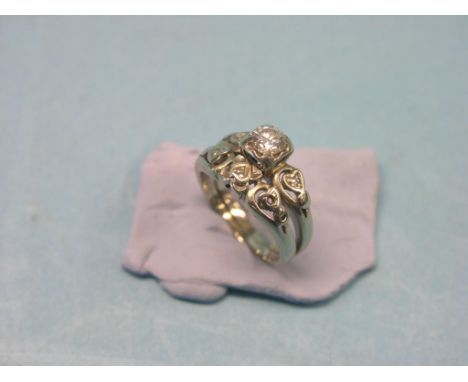 A 14ct. white gold and diamond ring, principal stone approx. 0.4ct., diamond chips to shoulders, size J/K