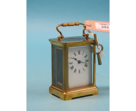 A French brass carriage clock, with enamelled dial and timepiece movement, obis case, with key, 5.5in.
