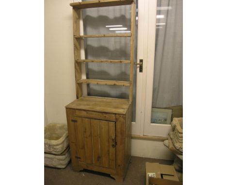 A Victorian stripped and waxed pine cottage dresser, three-shelf plate rack above cupboard base, 2ft.