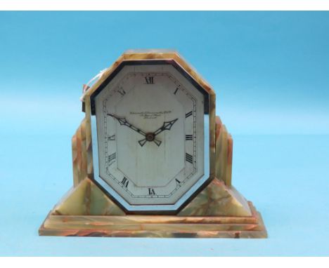 An Art Deco onyx mantel clock, Goldsmiths & Silversmiths Co. Ltd., with octagonal silvered dial and  early electric movement,