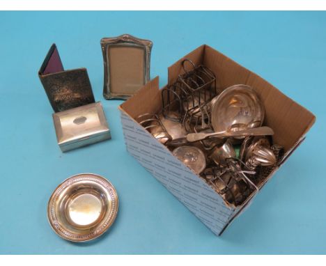 Five various silver toast racks, engine-turned silver cigarette case, silver-mounted glass dressing bottles, etc.