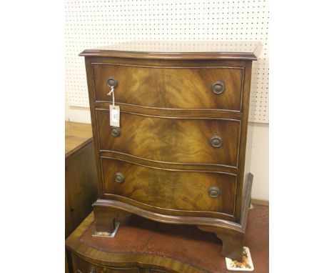 A Bevan Funnell Reprodux mahogany chest, three serpentine-fronted drawers, bracket feet, 1ft. 9in. 