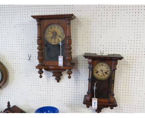 A 19th century German walnut wall clock, printed dial and gong-striking movment, with key and pendulum, 17.5in. high - pendul