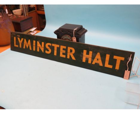 A Southern Railway station sign, Lyminster Halt, painted wood in S R green and cream livery, 47 x 8in. 