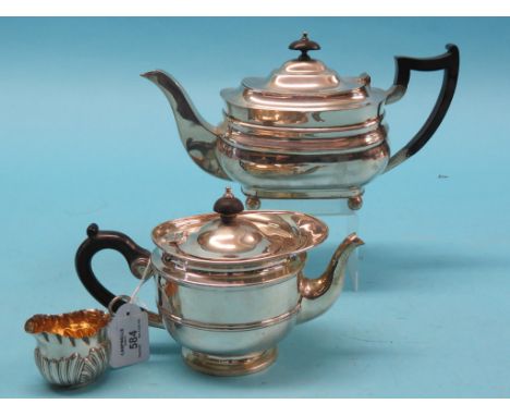 A silver teapot and matching sugar bowl, Birmingham 1905, approx. 19oz. gross total and a silver half-fluted cream jug