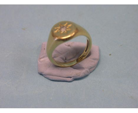 An 18ct. gold and diamond signet ring, size T, 13.9 grams gross total, diamond approx. 0.3ct.