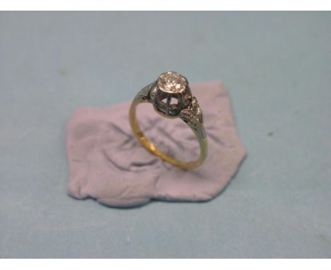 An 18ct. gold and diamond solitaire ring, stone approx. 0.5ct., high platinum claw setting with platinum shoulders, size M/N